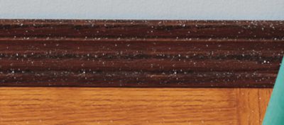 Wood trim with paint splattered on it.